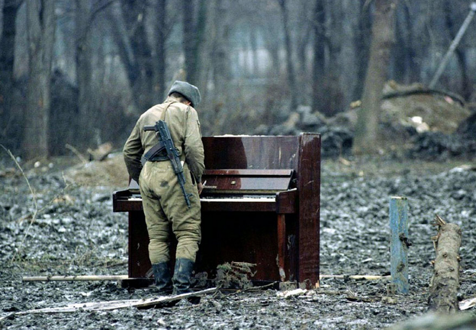 russian-soldier-playing-an-abandoned-piano.png